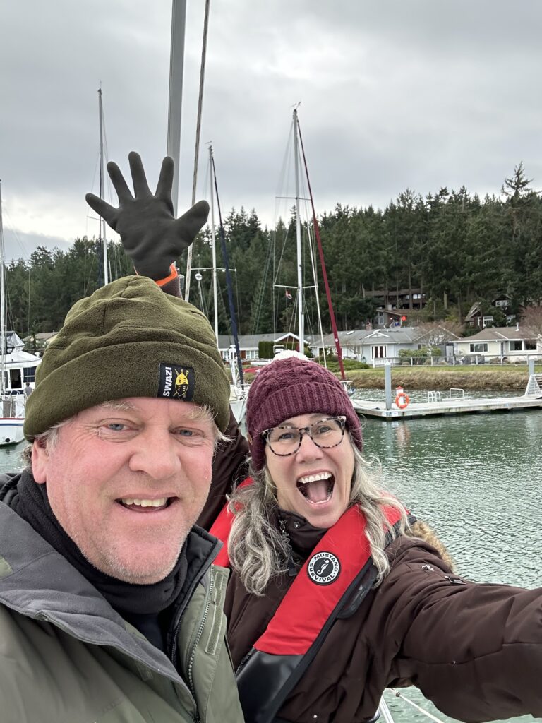 Heather and Chris in front of sailboat
