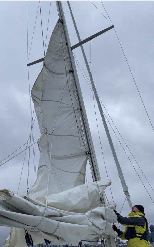 Sails being inspected on our boat survey