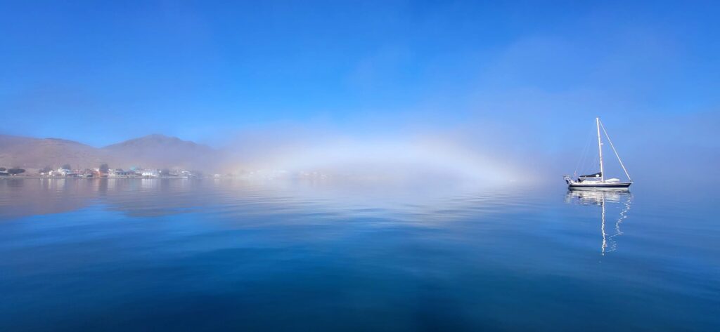 Gypsea Explorer Sailboat in Fog with Rainbow